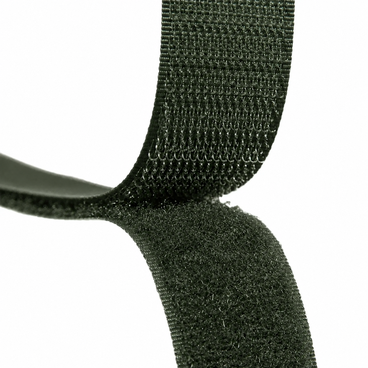 Close-up of a dark olive green hook-and-loop fastening strap on a plain white background.
